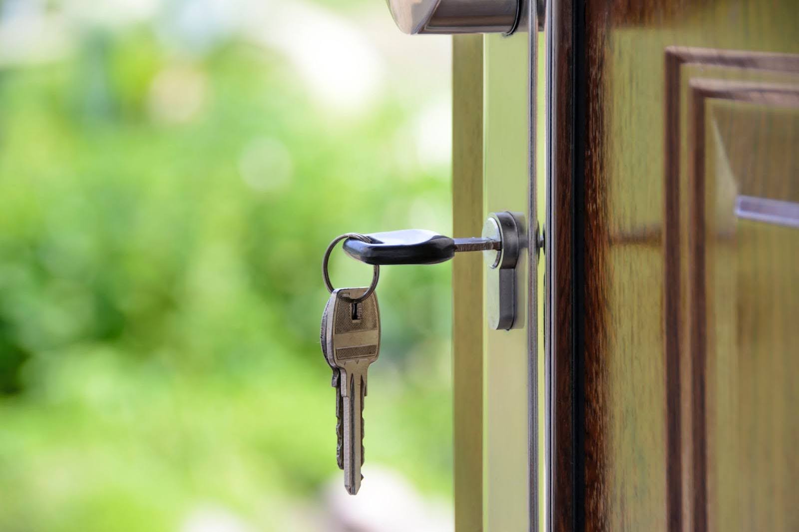 a key hanging from an open door