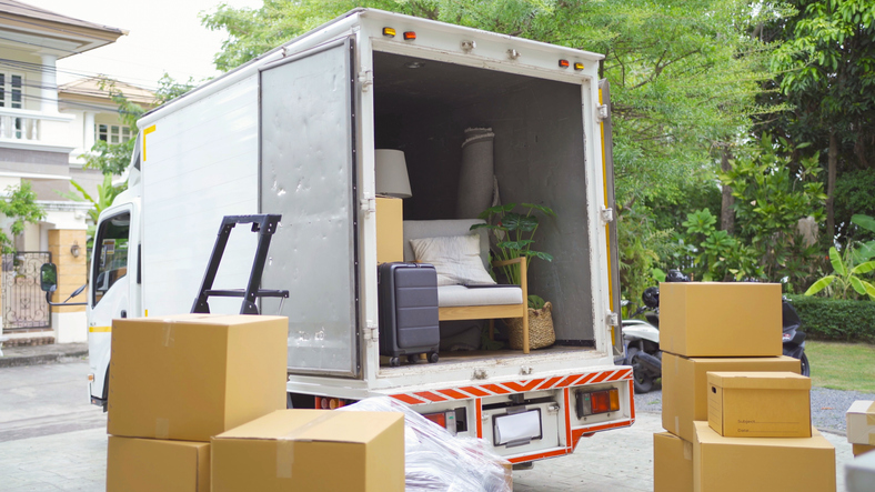 Truck car moving house for customers, delivering boxes and furniture. Vehicle transportation. Shipping and packaging business occupation service company. People lifestyle. Truck car moving house for customers, delivering boxes and furniture. Vehicle transportation. Shipping and packaging business occupation service company. People lifestyle.