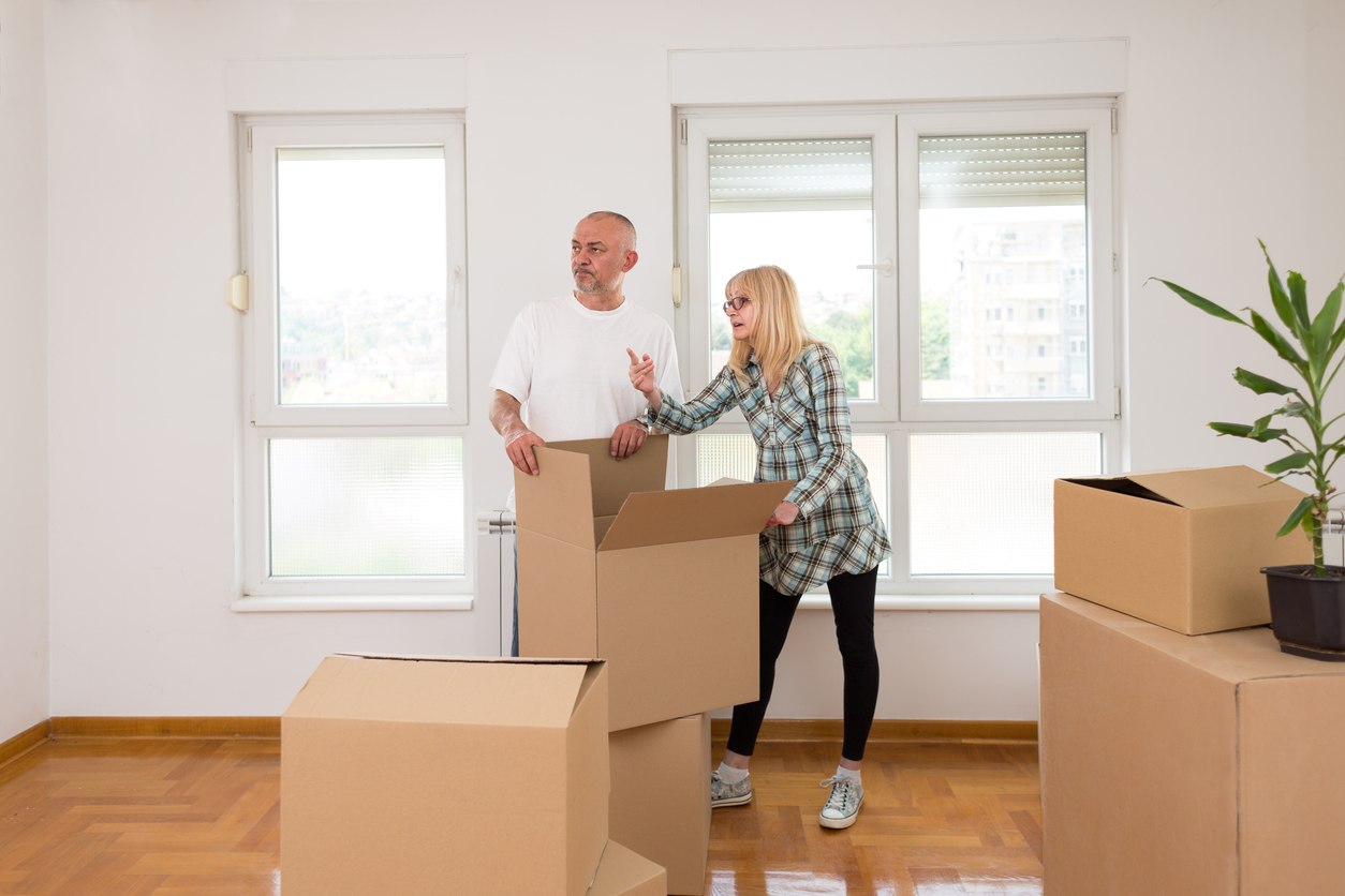 iStock-1063232966 A couple pack up their living room.