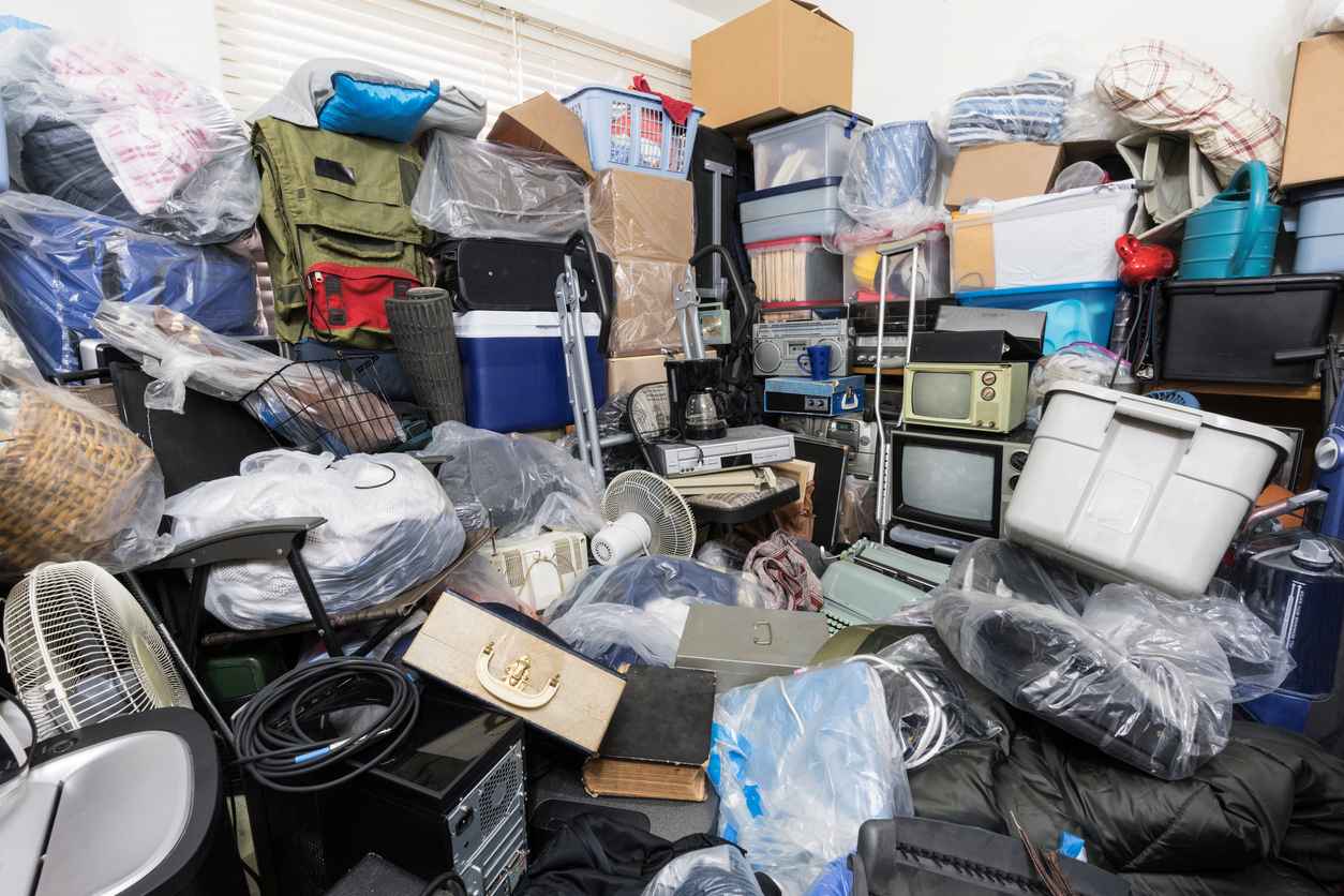 A bunch different items stacked up all over a room.