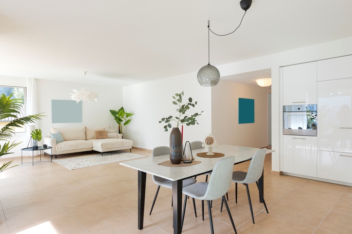 An eating area and living room staged for viewing.