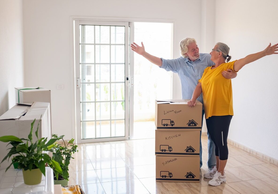 iStock-1431255029 Couple celebrates having packed up their house.