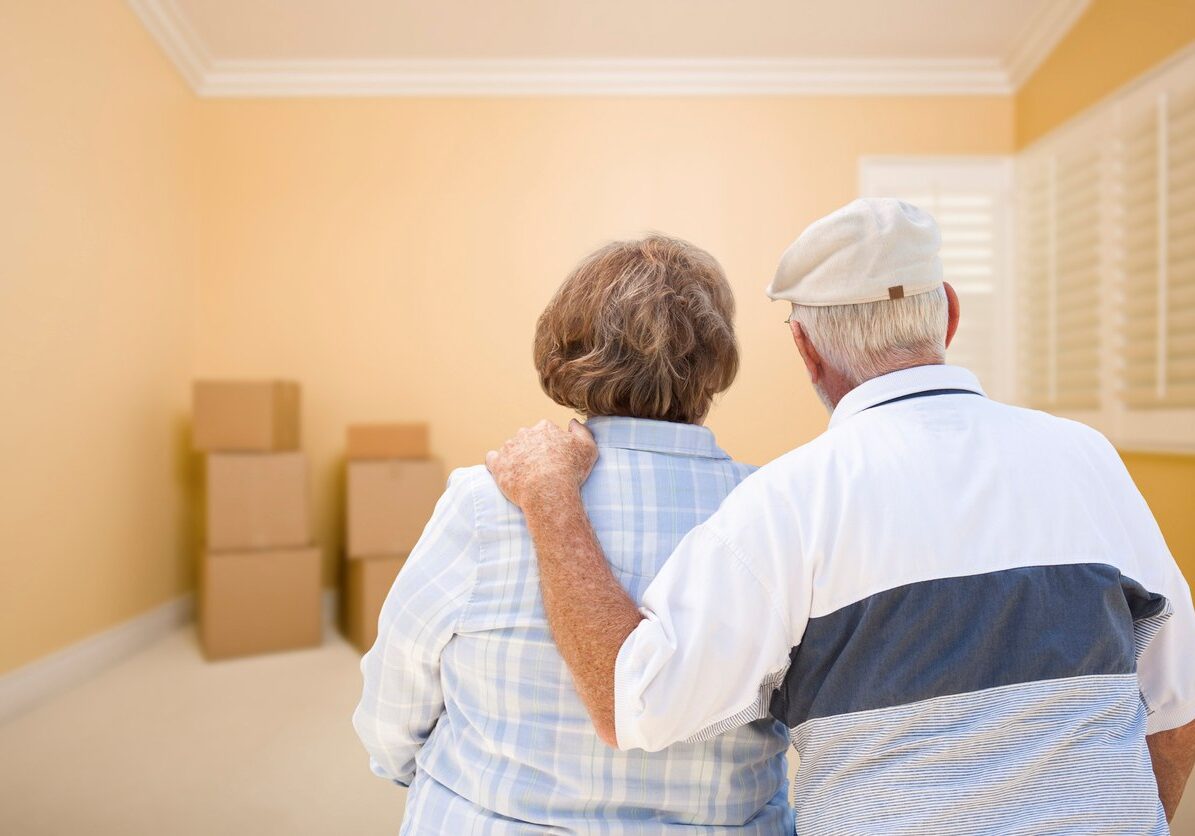 iStock-465848899 An older couple observes a room all packed up.